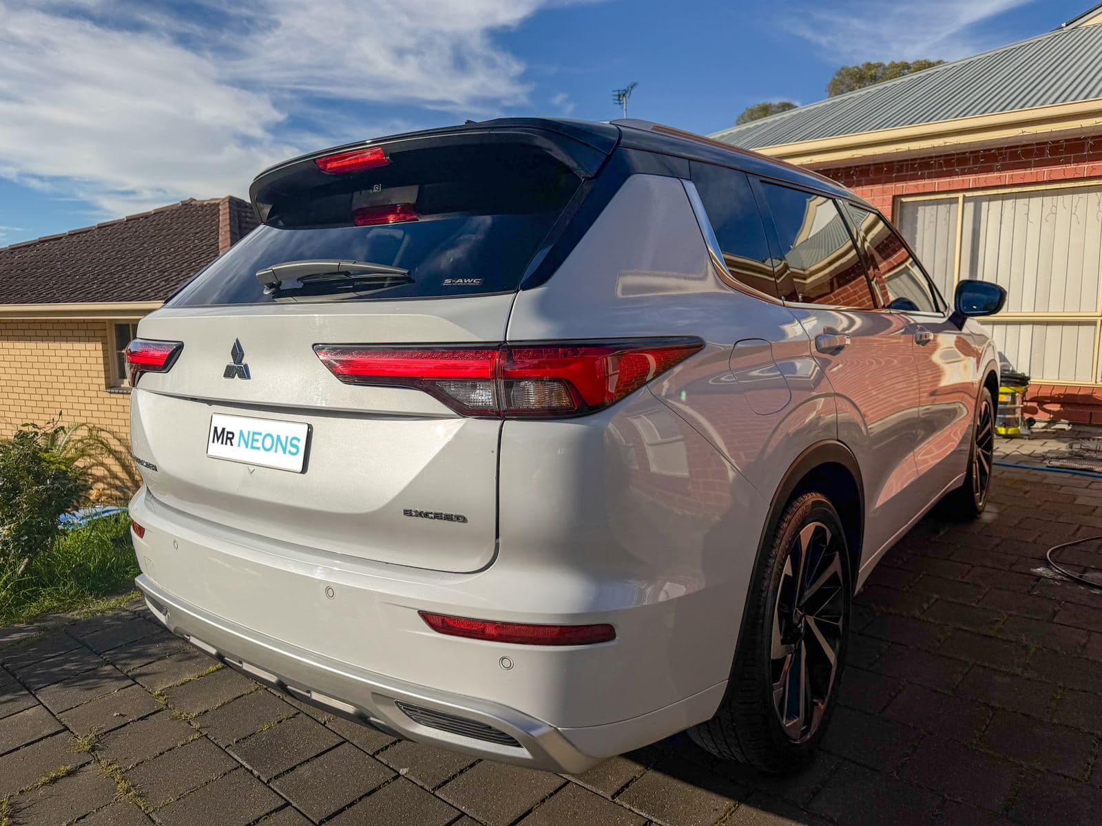 White Mitsubishi Outlander after a full detail