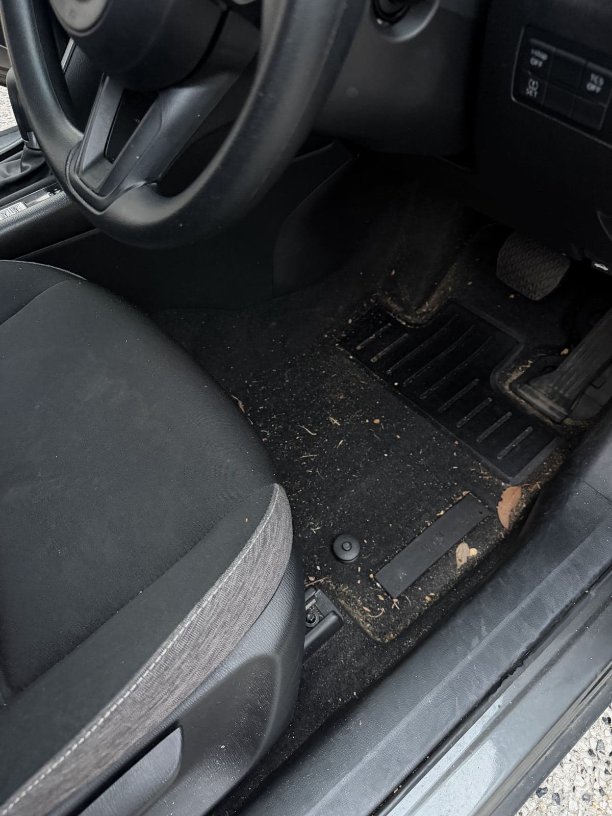 Before: muddy floor and mats ahead of a deep clean