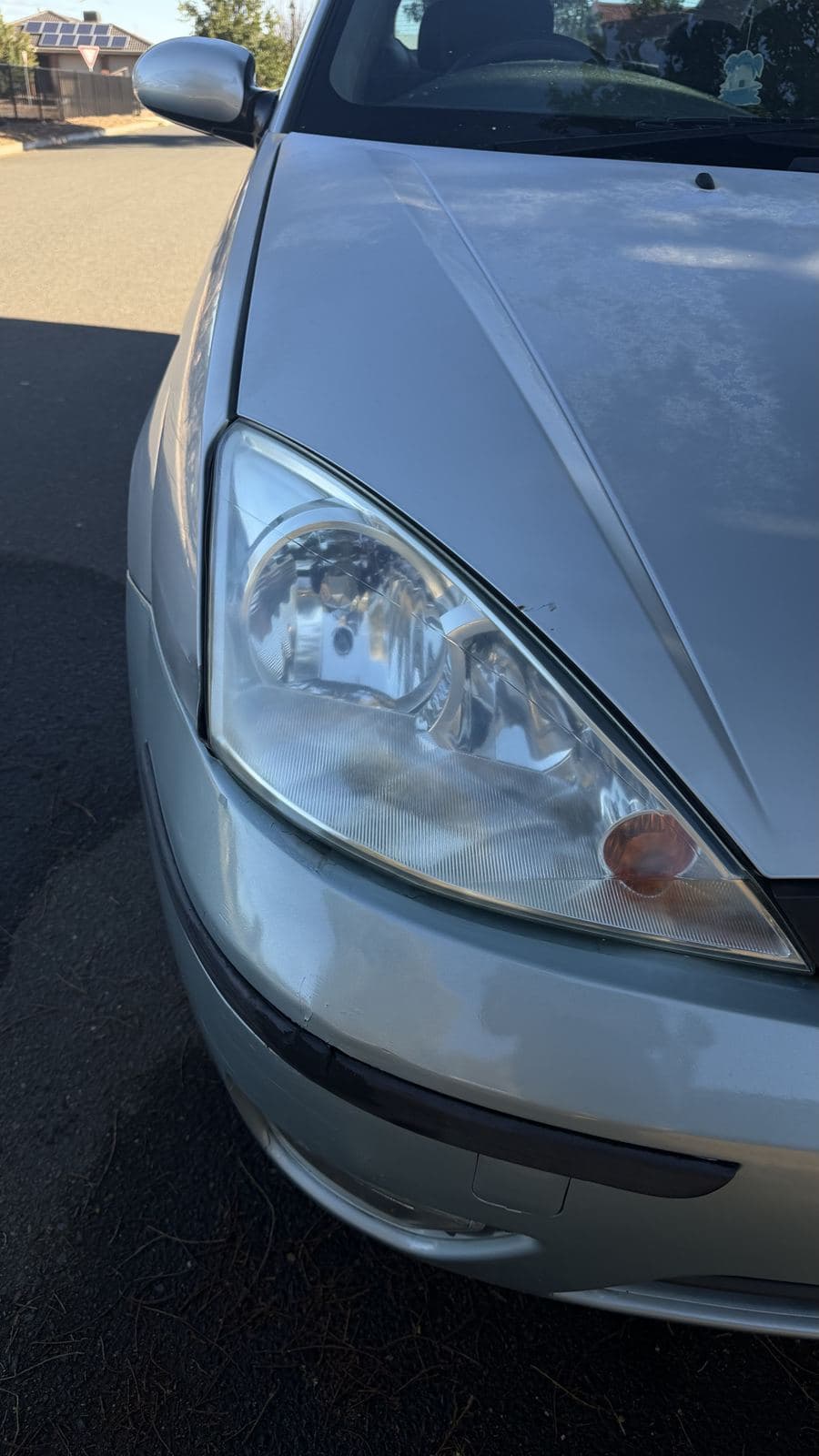 Before: cloudy Ford Focus headlight