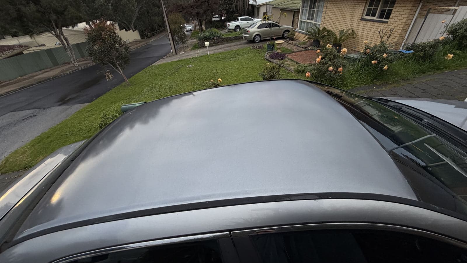 Before: faded clear coat on a roof