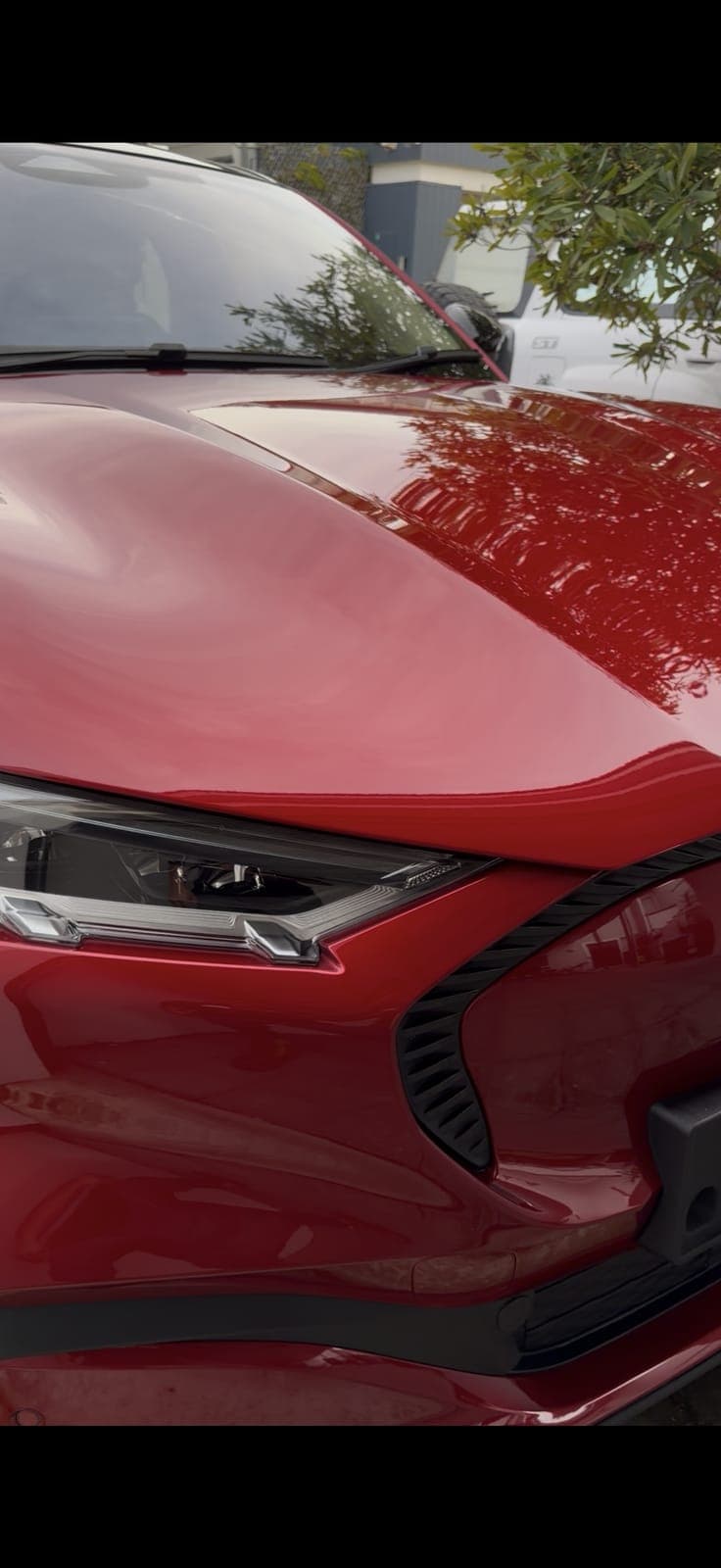 Red Mustang Mach-E front end after a full exterior detail