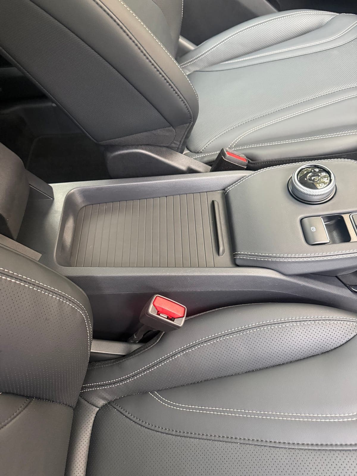 Mach-E centre armrest and seats after an interior detail
