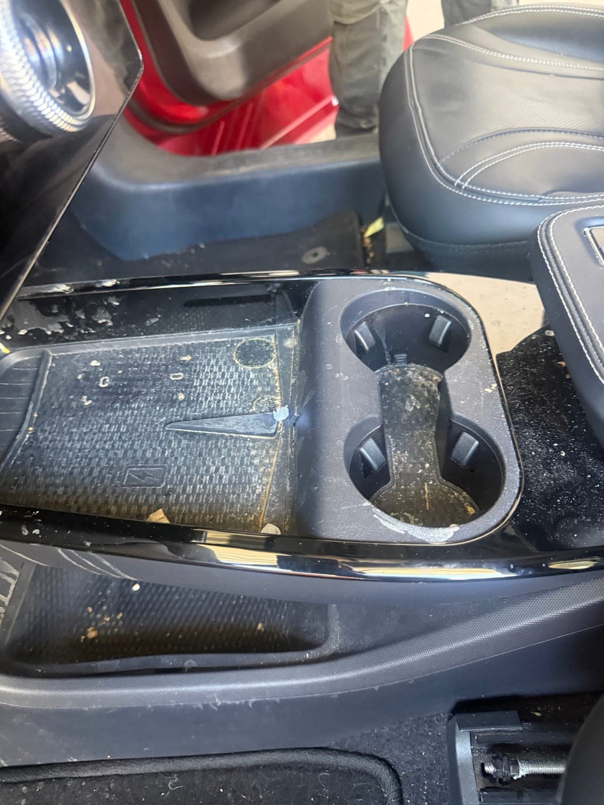 Before: grimy Mach-E centre console and cupholders