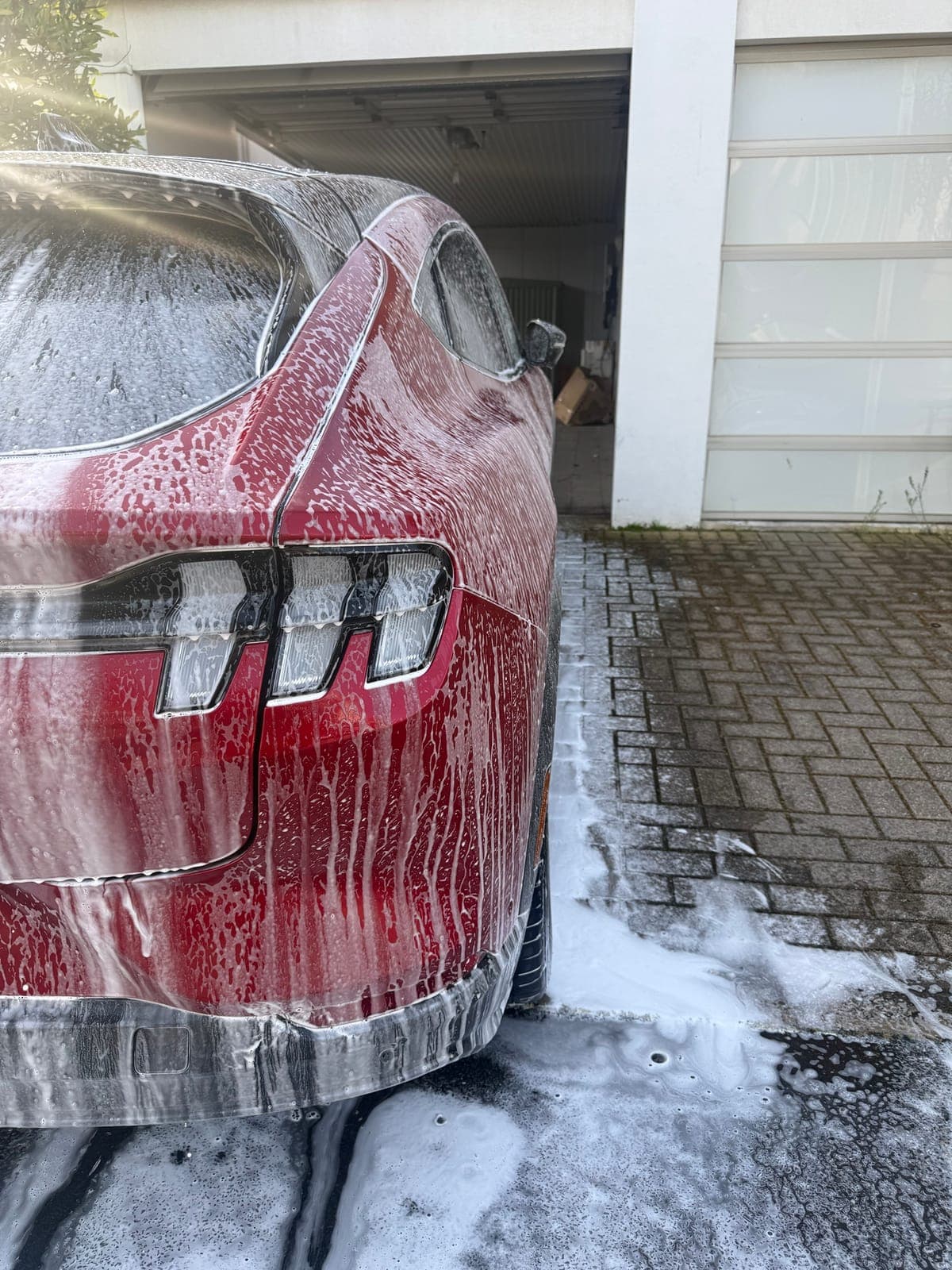Snow foam wash on a Mustang Mach-E, rear view