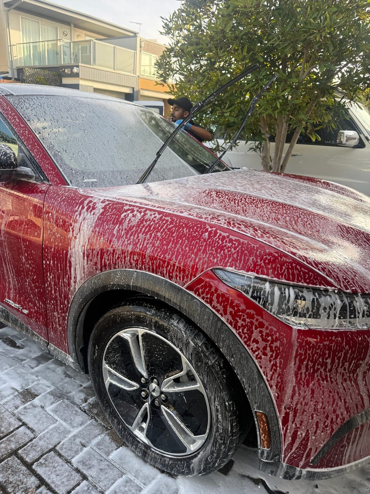MR NEONS detailer foam washing a Mustang Mach-E